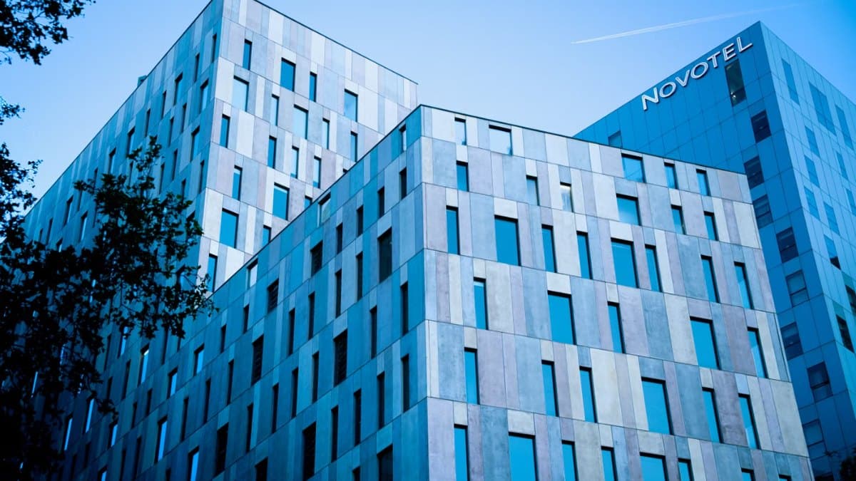 Modern hotel and office architecture under a clear blue sky