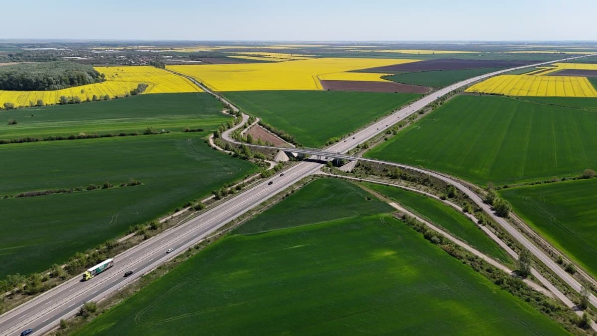 Aerial view of a highway running through green Ontario countryside