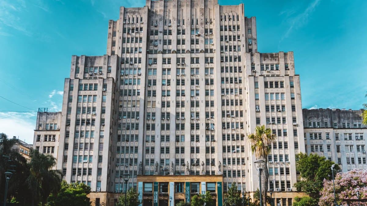 Grand historic university building with a landscaped forecourt
