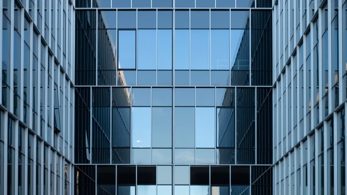 Contemporary building facade with reflective glass windows