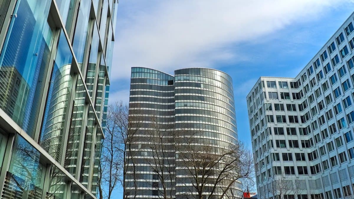 Modern city towers against a clear blue sky