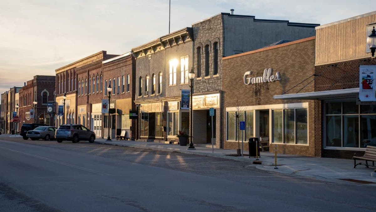 Quaint historic downtown street at sunset with heritage storefronts