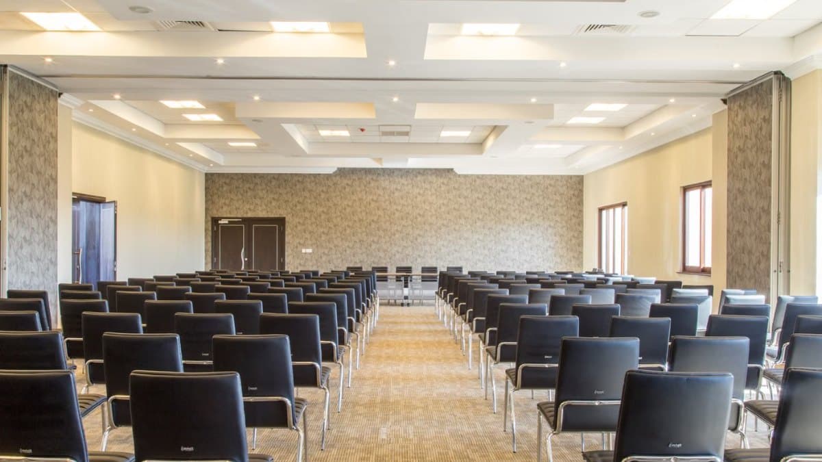 Spacious modern conference room with neatly arranged seating