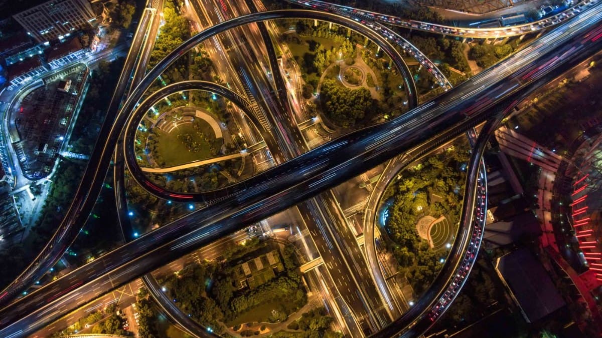 Aerial view of an intricate highway interchange and surrounding roads