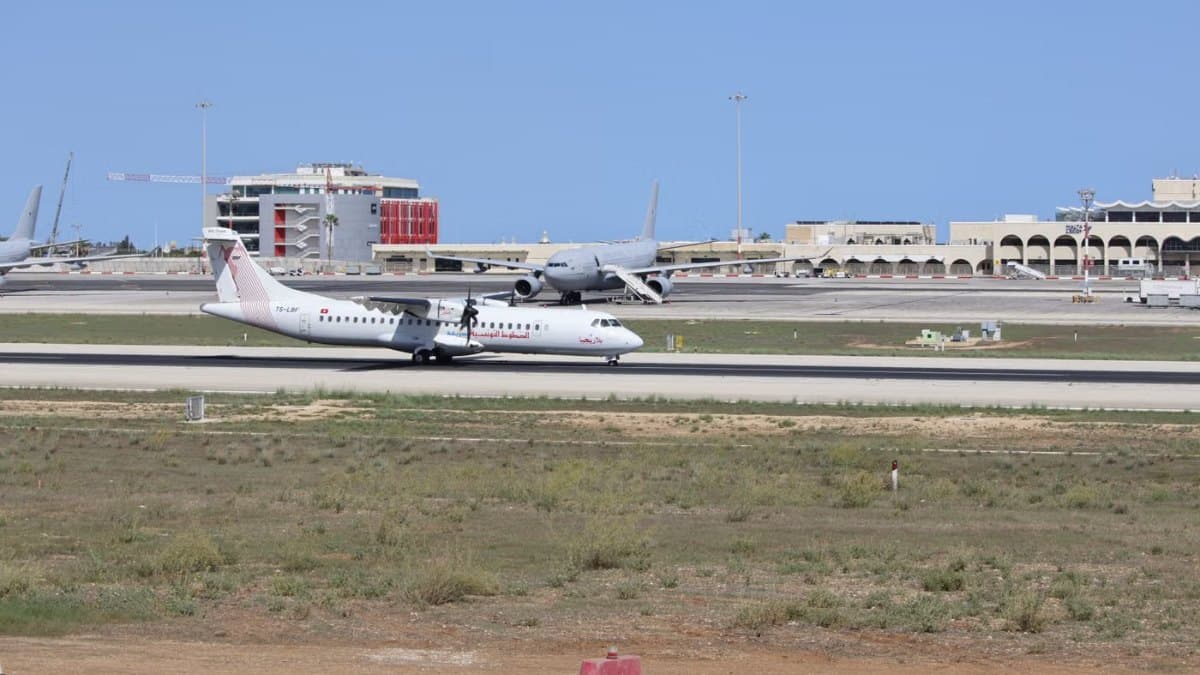 Commercial airplane preparing for takeoff on a sunny day
