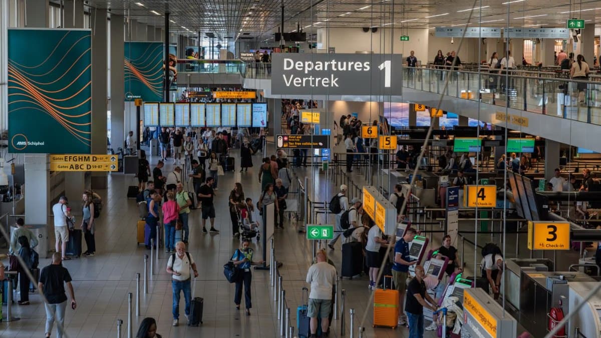 Travellers in the departure area of a busy international airport