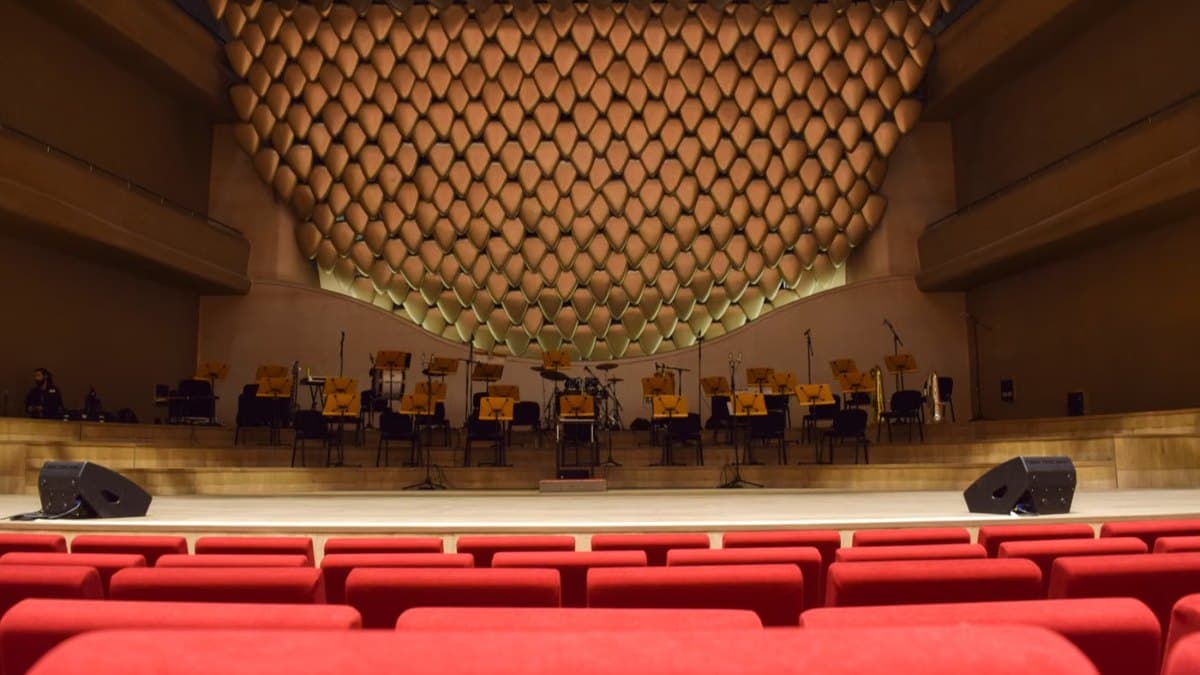 Elegant concert hall interior with empty seats and a stage