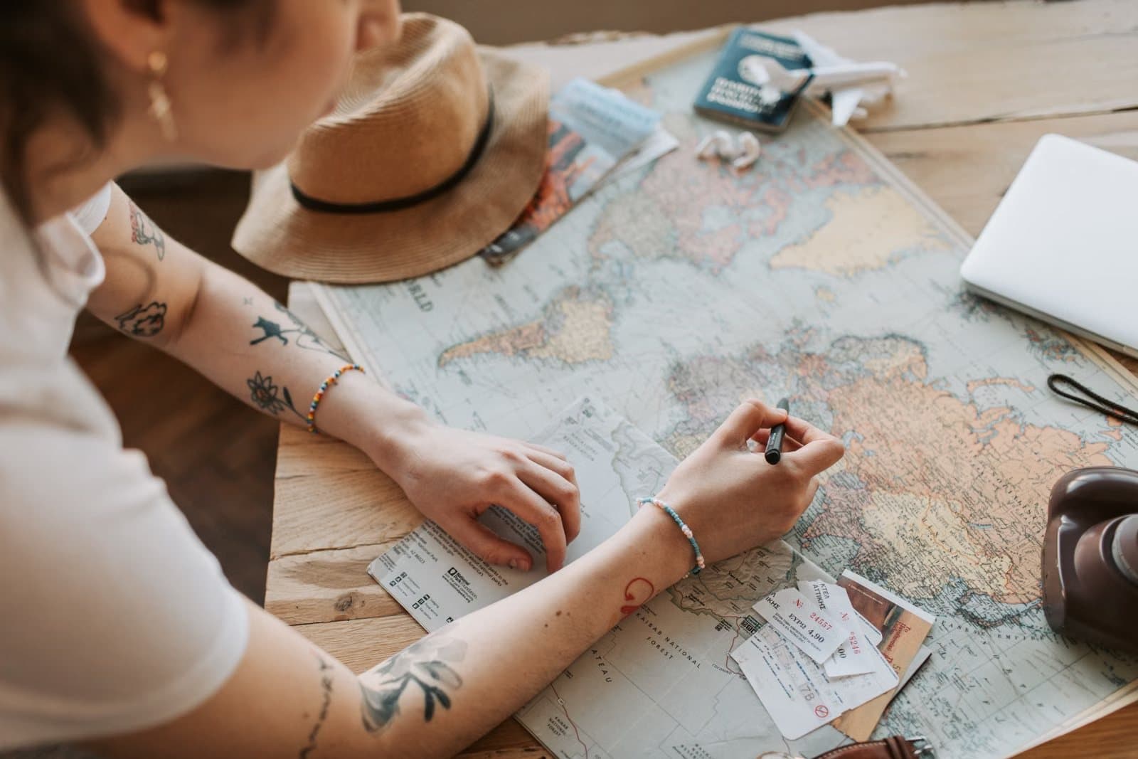 Travel planning with a world map and passport