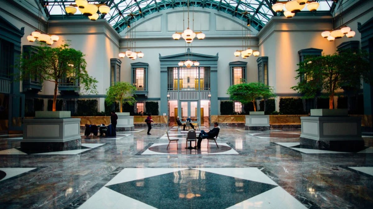 Spacious luxury hotel lobby with modern architecture and seating