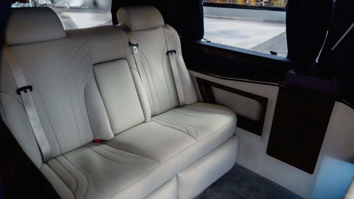 Spacious executive van interior with comfortable seating for groups