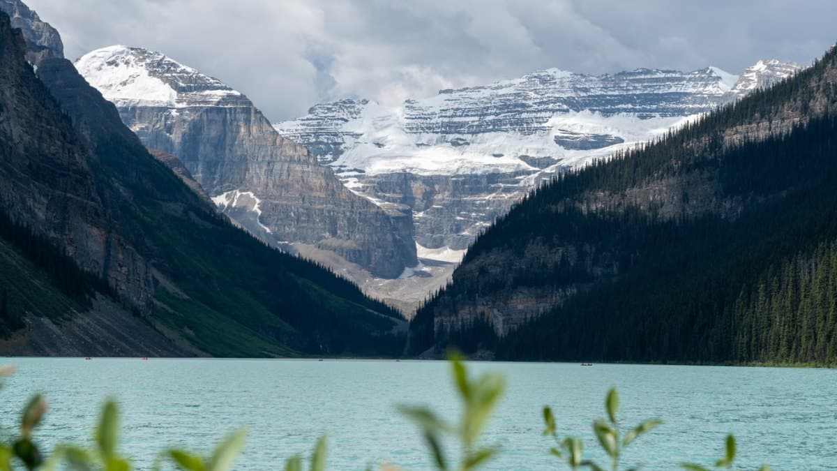 View of Lake Louise with mountains and glacier reflections