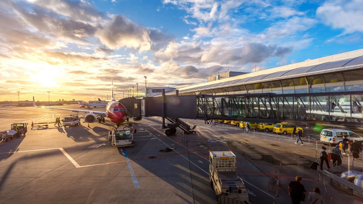 Private jet on the ramp with a waiting chauffeur-driven vehicle