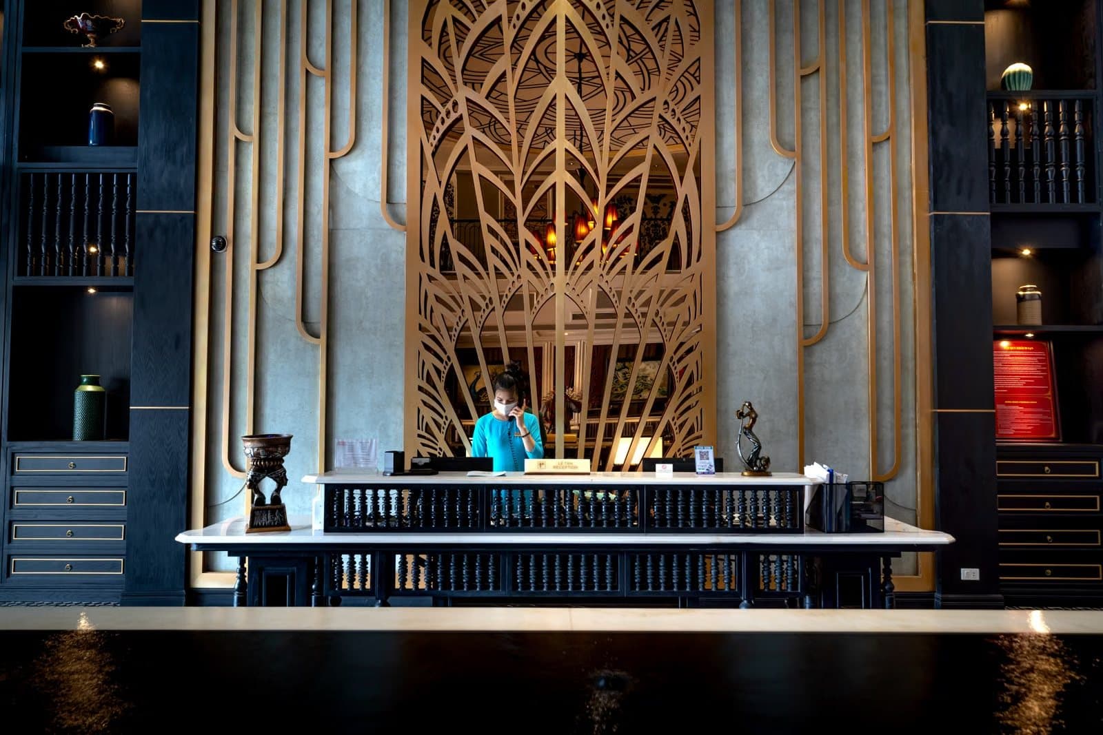 Hotel reception desk where a concierge arranges guest transport